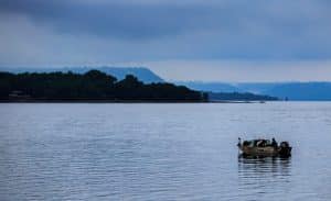Single fishing boat on Lake Pepin in early morning.